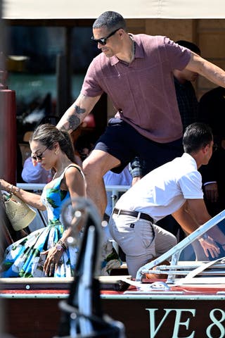 October Gonzalez and Tony Gonzalez board a water taxi